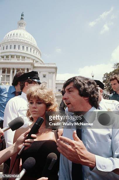 Hollywood actress Jane Fonda and peace activist/politician Tom Hayden talk to the press at the U.S. Capitol at an anti-war protest.
