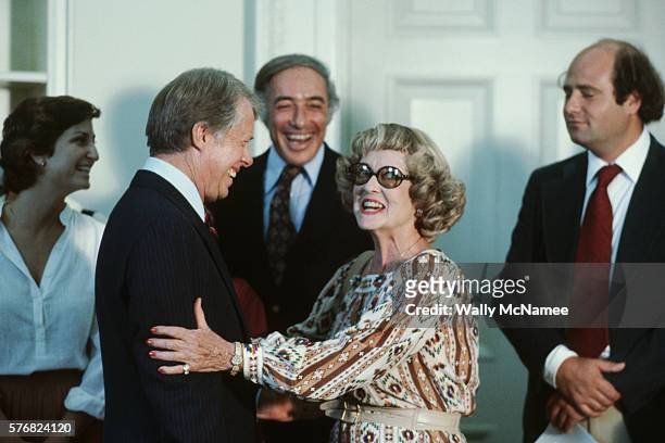 President Jimmy Carter greets legendary actress Bette Davis at the White House.