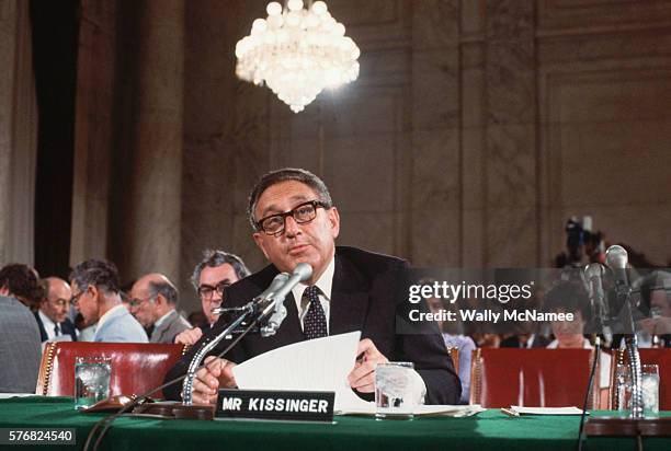 Secretary of State Henry Kissinger testifies before a Senate committee in the Caucus Room in the old Senate office building in Washington, DC.