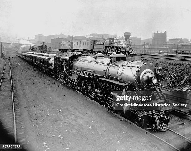 An all-steel 1924 Oriental Limited train and the original Great Northern Railway train of 1862, engage on a transcontinental exhibition tour from...