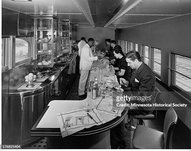 Travelers Eating in Dining Car