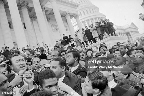 Rep Adam Clayton Powell speaks to a rally for him at the U.S. Capitol. Powell is on the left.