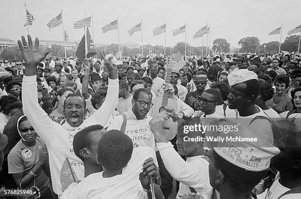 Participants in the landmark civil rights protest, the March on Washington, stand at the base of the Washington Monument grounds while awaiting the...