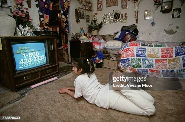 Juarez, Mexico: A girl watching television.