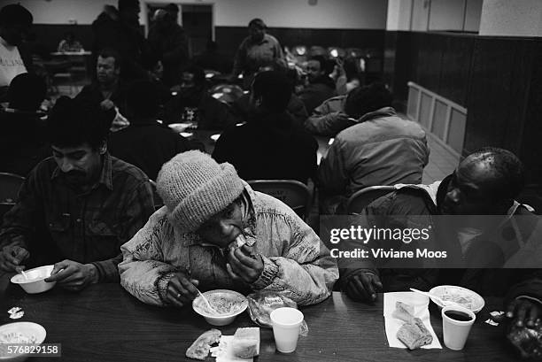 Homeless people enjoy a meal at Love Gospel Assembly soup kitchen. The Love Gospel Assembly serves five-star meals to people in need at their soup...