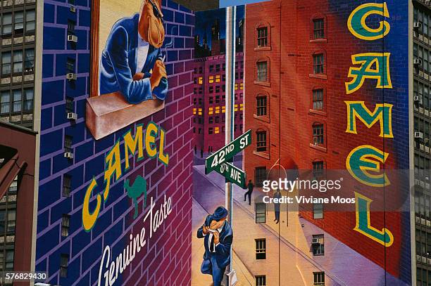 An advertisement for Camel cigarettes on the side of a building in New York City.