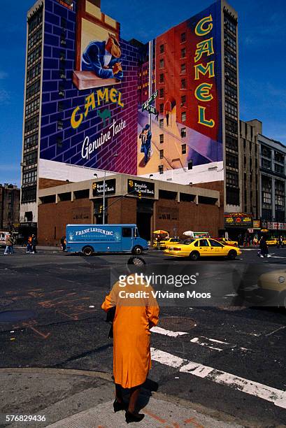 An advertisement for Camel cigarettes on the side of a building in New York City.
