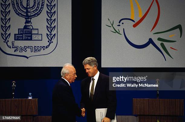 President Bill Clinton shakes hands with Prime Minister Yitzhak Rabin after a press conference in Jerusalem.