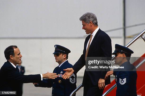 rudolph giuliani greeting president clinton at airport - rudolph stock pictures, royalty-free photos & images