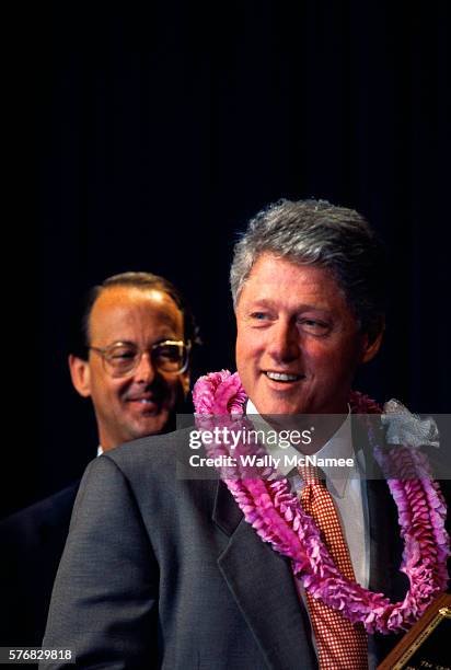president clinton wearing a lei - erskine bowles photos stock pictures, royalty-free photos & images