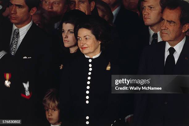 Lady Bird Johnson, her daughter Luci, and President Nixon attending funeral ceremony for Lyndon Johnson at the University of Texas.