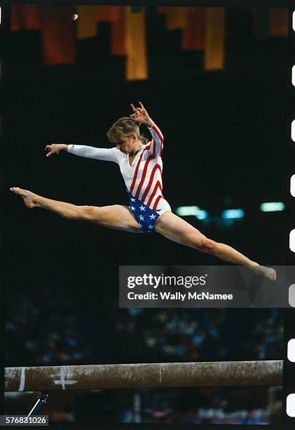 The U.S. Team won Silver medal at these Games. U.S. Female gymnast Kathy Johnson leaps high above the Balance Beam during team gymnastics competition...