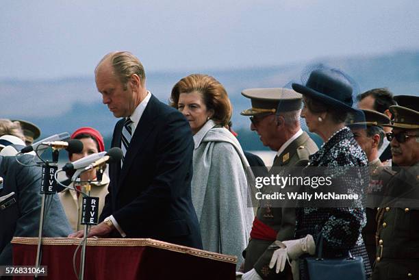 President Gerald Ford and wife Betty arriving in Madrid, Spain, for a brief visit are attended by long-time Spanish leader General Franco and his...