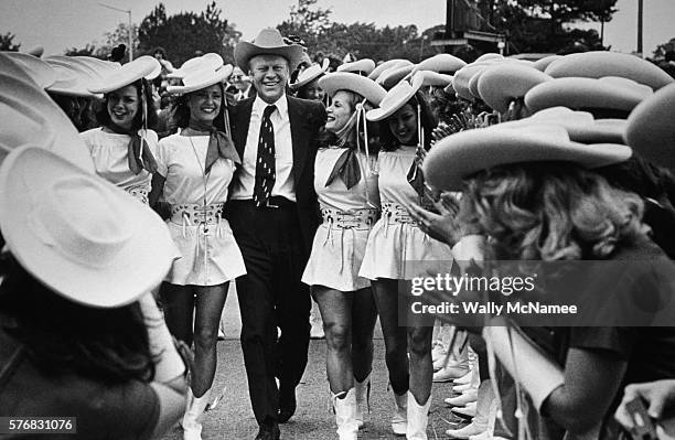 President Gerald Ford walks with the Kilgore College Rangerettes in Kilgore, Texas, during the Texas Presidential primary.
