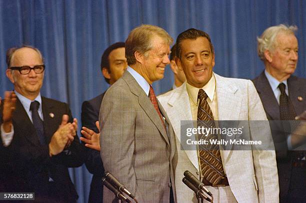 President Carter and Panamanian dictator Omar Torrijos Herrera are applauded after both signed the Panama Canal Treaty. The agreement states that the...