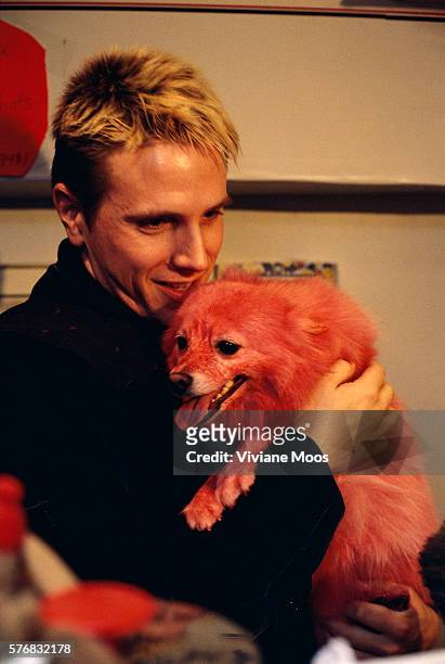 Shawn and his American Eskimo dog Misha, dyed pink.