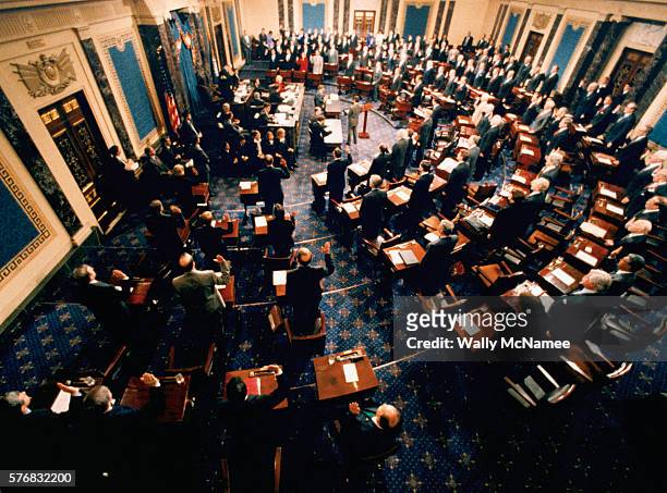In the chamber of the United States Senate, Supreme Court Chief Justice William Rehnquist swears in the Senate members to participate in the...