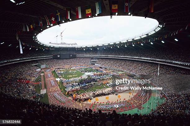 Athletes parade around the track at Olympic Stadium during the opening ceremony for the 1976 Summer Olympic Games.