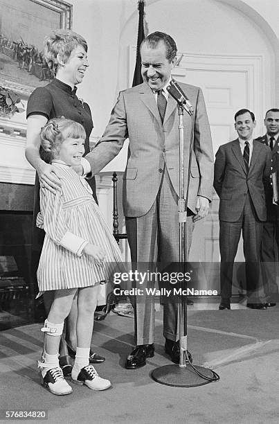 President Richard Nixon at the White House with the 1969 National Easter Seal Child, seven year old Donna Kay Howell, and National Easter Seal...