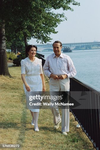 Bob and Elizabeth Dole Walking Along a River