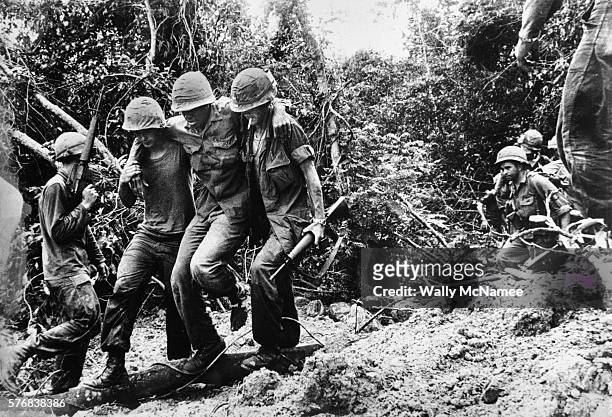 soldiers transporting wounded to medevac - vietnam war stock pictures, royalty-free photos & images