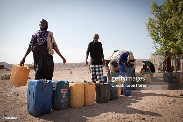 Members of the Puntland Maritime Police Force distirbuting water near Bosaso, Somalia. The Puntland Maritime Police Force is a locally recruited,...