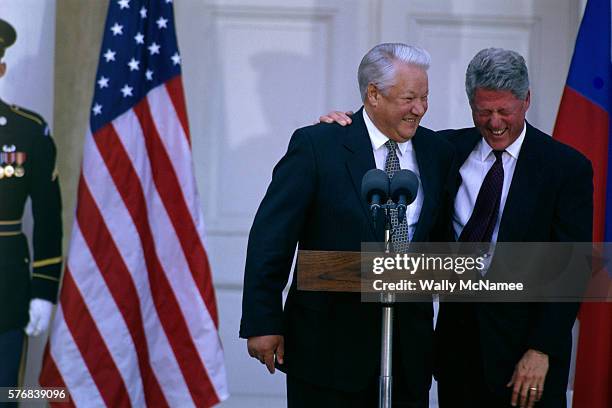 American President Bill Clinton laughs at Boris Yeltsin's jokes during a joint news conference in Hyde Park, New York