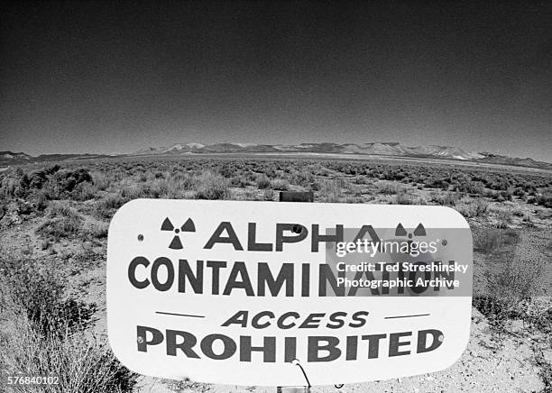 Sign stands on Frenchman's Flat where nuclear weapons tests took place in Mercury, Nevada. | Location: Mercury, Nevada, USA.