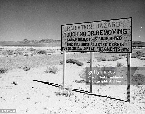 Sign stands on Frenchman's Flat where nuclear weapons tests took place in Mercury, Nevada. | Location: Mercury, Nevada, USA.