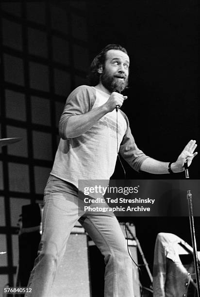 Comedian George Carlin performs at San Quentin Prison at a concert staged by the Hell's Angels.