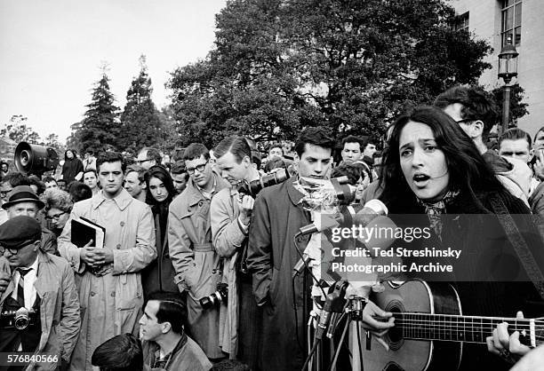 Folk singer Joan Baez performs at a rally for the Free Speech Movement at the University of California at Berkeley.