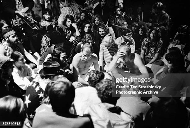 Ken Kesey and Neal Cassady , sit shirtless in the middle of a circle during the Acid Test Graduation. At the ceremony, organized by Kesey and his...