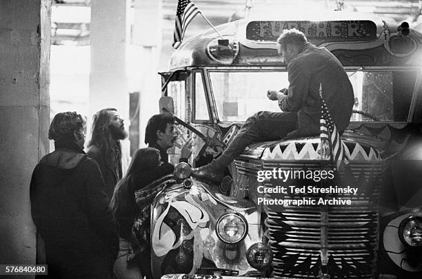 Chet Helms , the operator of the Avalon Ballroom, listens, along with some of the Merry Pranksters, to Ken Kesey, author and leader of the...