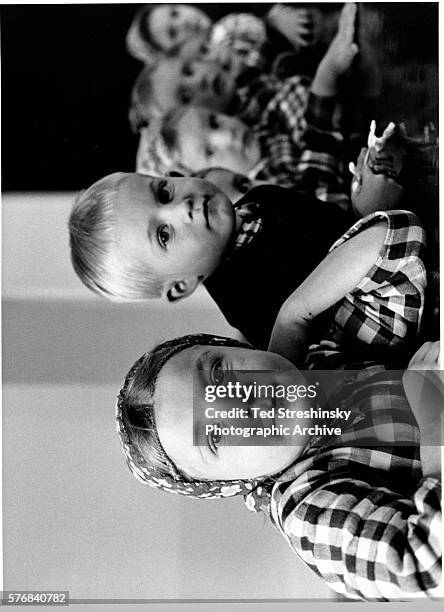 Hutterite Children sit at a table in the Preschool area at Miller Colony. A fundamentalist religious sect, the Hutterites live in community and...