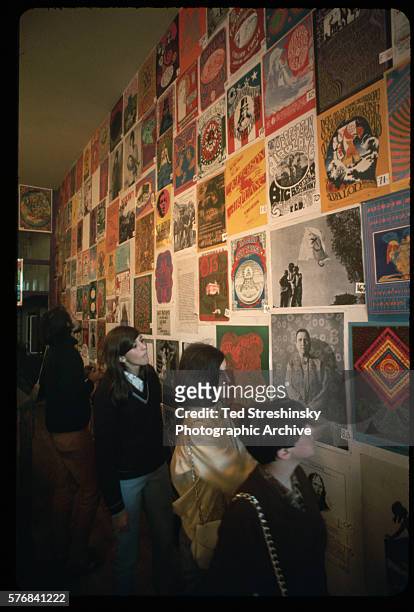 Teenagers browse through a popular psychedelic poster shop in the Haight Ashbury district. San Francisco, 1967.