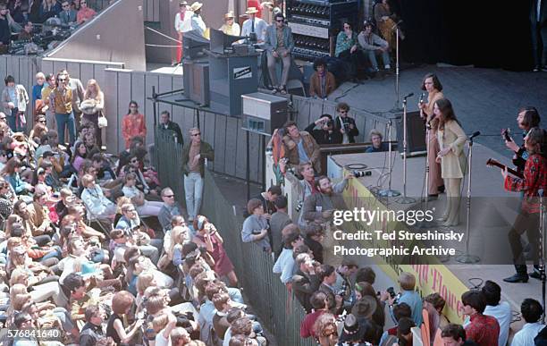 Janis Joplin with the guitarists of Big Brother and the Holding Company, on stage at the Monterey Pop Festival. The fame garnered from this...