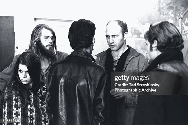 Ken Kesey and a few of his Merry Pranksters have a discussion.