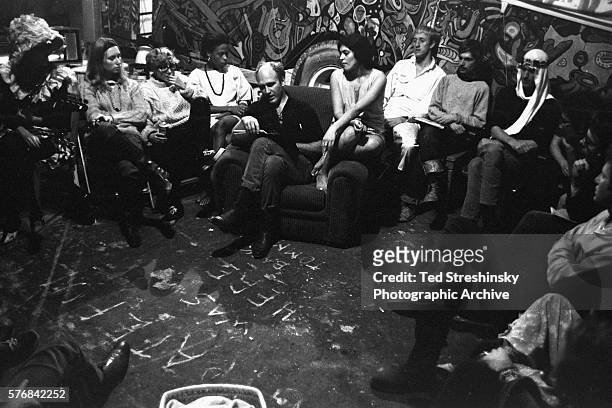 Ken Kesey has called a meeting of the Merry Pranksters leaders to plan for the Acid Test Graduation.
