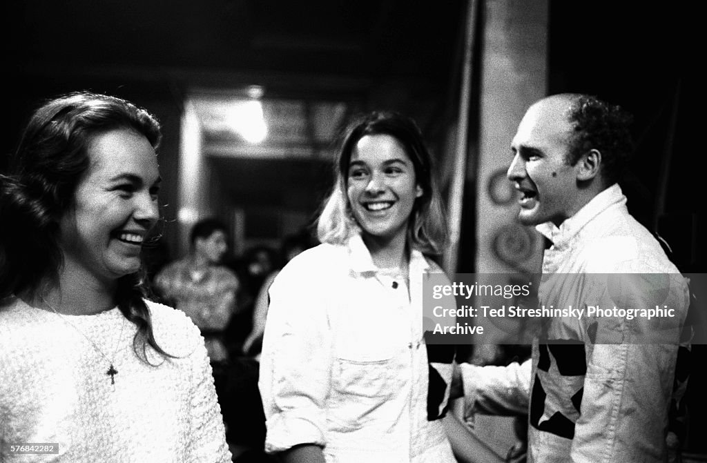 Ken Kesey and his wife Faye talk with his girlfriend Mountain Girl