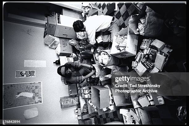 Volunteers at the Haight-Ashbury Free Medical Clinic sort through donated medical supplies. | Location: Haight- Ashbury district, San Francisco,...