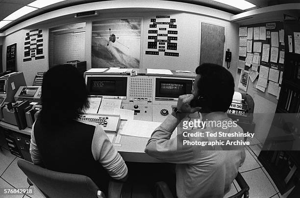 Two technicians man the control room for the satellite Pioneer 10 at Moffet Air Force Field in Sunnyvale, California. | Location: Moffet Air Force...