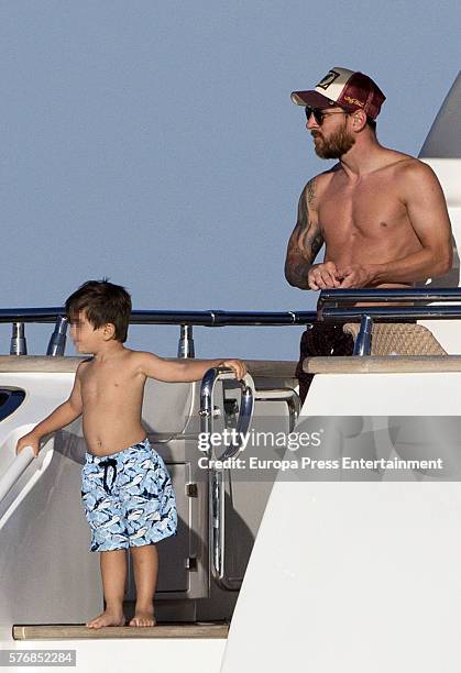 Barcelona football player Lionel Messi and his son Thiago Messi are seen on July 16, 2016 in Ibiza, Spain.