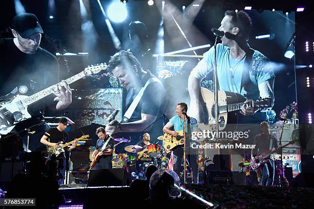 Recording artist Jonny Buckland, actor Michael J. Fox, and recording artists Will Champion, Chris Martin, and Guy Berryman of Coldplay perform...
