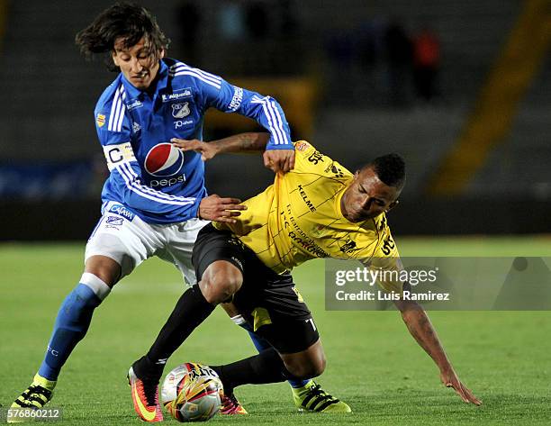 Rafael Robayo of Millonarios vies for the ball with Nelson Barahona of Alianza Petrolera, during a match between Millonarios and Alianza Petrolera as...