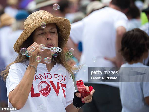 Members of the activist group Code Pink protest in front of Cleveland police officers during a demonstration near the site of the Republican National...