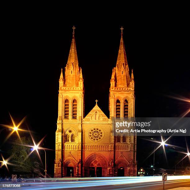 st peter's cathedral lights up at night, adelaide, south australia - adelaide night stock pictures, royalty-free photos & images