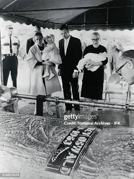 Family members of Lee Harvey Oswald at his funeral at Rose Hill Memorial Park in Fort Worth, Texas. Standing under the canopy from left are Marina...