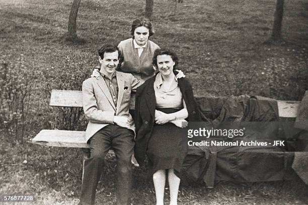 Lee Harvey Oswald sits in a park with Marina Nikolayevna Prusakova and her aunt Valentina Guryevna.