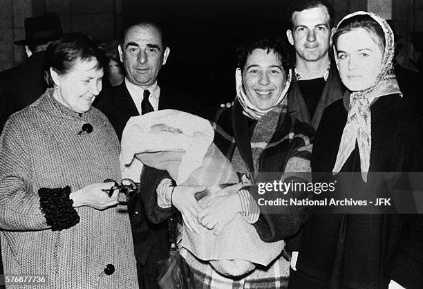 Lee Harvey Oswald with Marina and friends in Russia before boarding the train for their departure from the country.