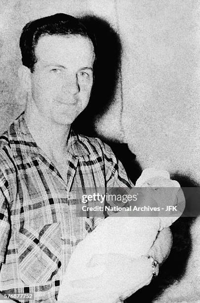 Lee Harvey Oswald Holding Daughter June